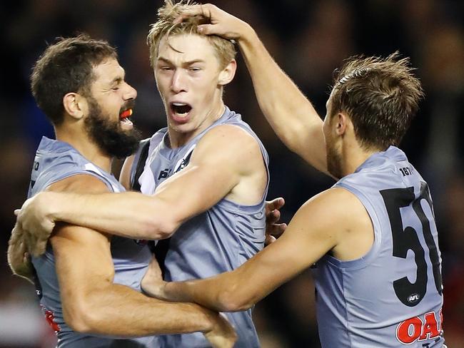 Power’s forward line kicked 19.12 — including 14.2 from set shots — in their 59-point win over Essendon. Paddy Ryder, Todd Marshall and Cam Sutcliffe celebrate one of those goals. Picture: MICHAEL WILLSON/AFL PHOTOS VIA GETTY IMAGES