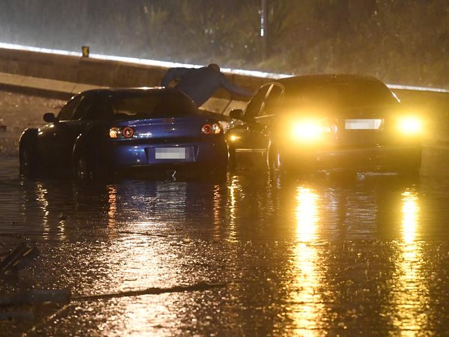 Emergency Services were called to the M4 entrance at Strathfield around 4:15 yesterday morning for two cars stuck in floodwater / Picture: Gordon McComiskie