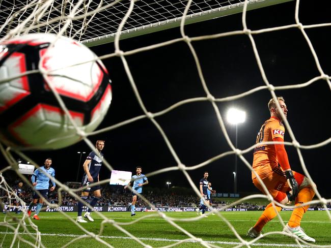 Lawrence Thomas watches as a shot on goal by Adam Le Fondre sails past. 