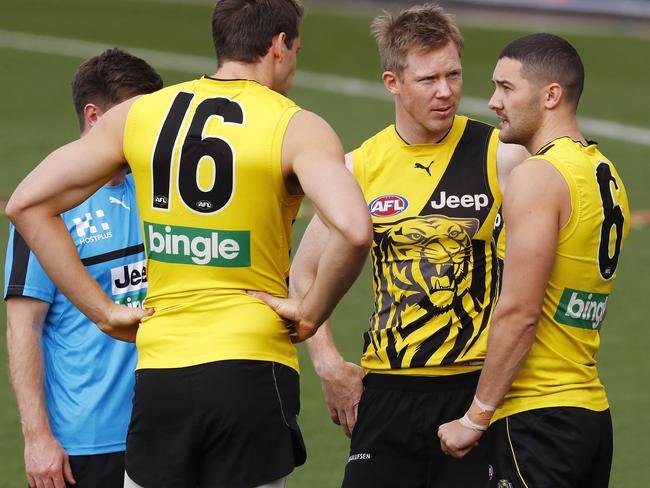 Richmond training. Jack Riewoldt chats with Shaun Grigg and Shaun Hampson . Pic: Michael Klein