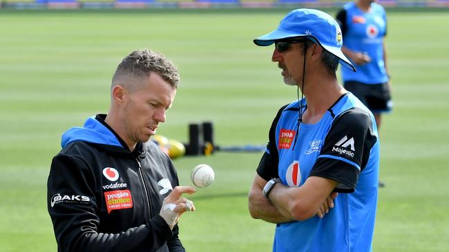 Peter Siddle and coach Jason Gillespie at training. Picture: AAP Image/Sam Wundke