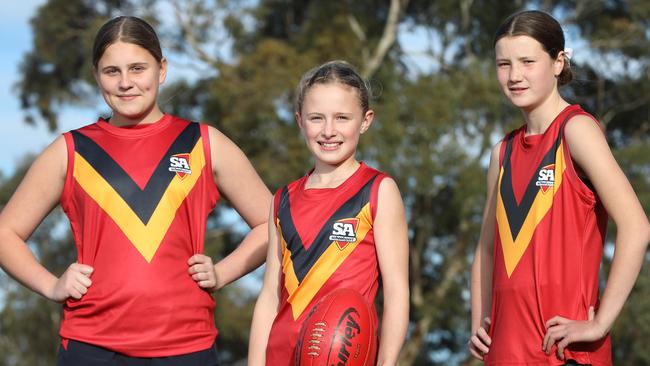 Scarlett Kelly (left) with vice-captains Jaiya Thornton and Lara Gribbin ahead of the School Sport Australia Under-12 Australia Football Championships. The tournament will be live streamed here by KommunityTV from August 7-12. Picture: Dean Martin