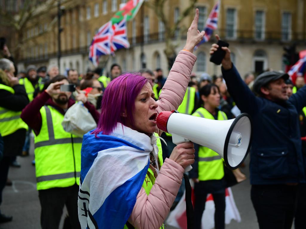 Pro-Brexit demonstrators wearing yellow vests protest outside Westminster, in London on Saturday (local time) before the parliament vote on Tuesday. Picture: Getty Images