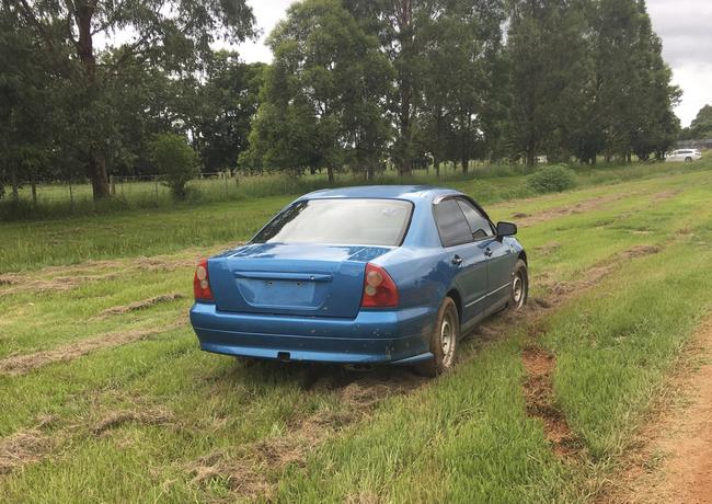 A car that crashed into a fence and a stormwater drain after losing control on the dirt section of Prince Street, Grafton.