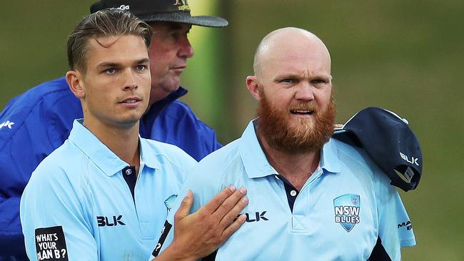 Chris Green, left, and Doug Bollinger in action yesterday in Sydney. Picture: Phil Hillyard