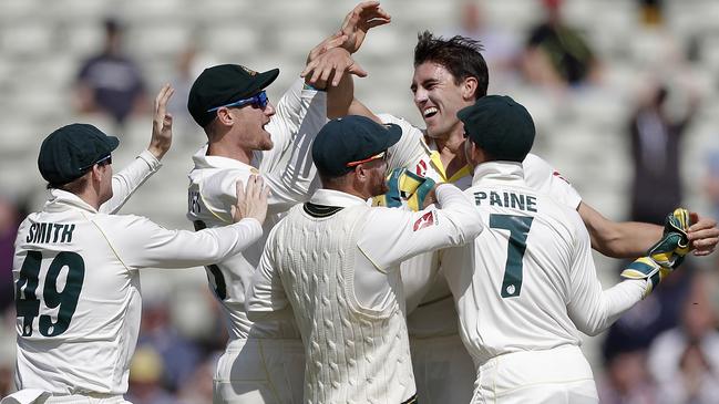 Pat Cummins is swamped by team-mates. Picture: Getty Images