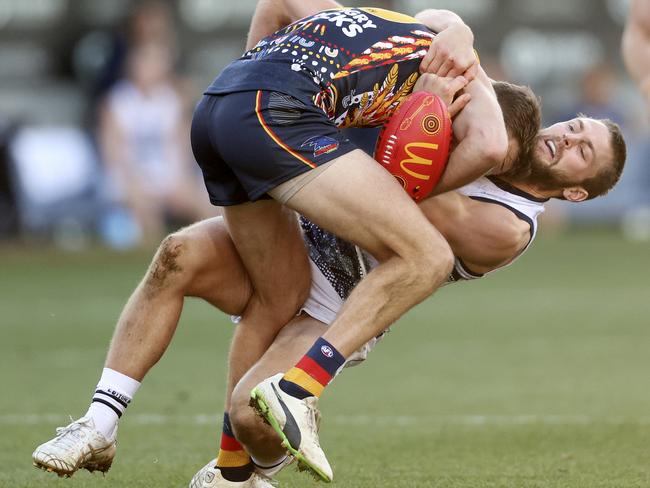 Not many players escape a Tom Atkins tackle. Picture: Martin Keep/Getty Images