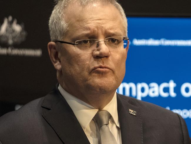 Prime Minister Scott Morrison with the Chief Medical Officer Brendan Murphy during a press conference at Parliament House in Canberra. Picture Gary Ramage