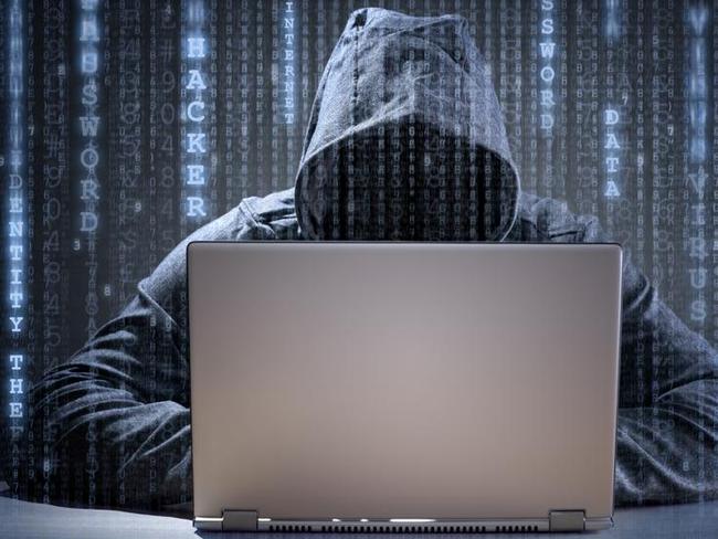Computer hacker stealing data from a laptop concept for network security, identity theft and computer crime