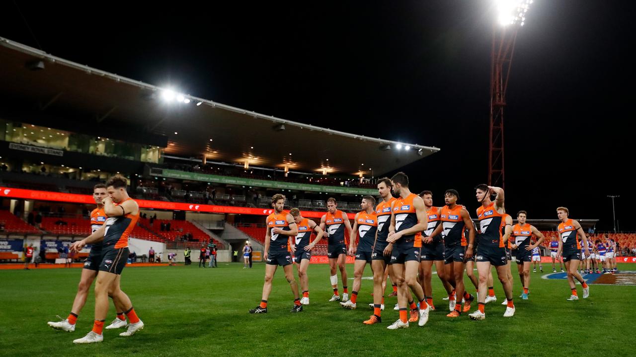 The GWS Giants leave the field after a loss. Picture: Dylan Burns