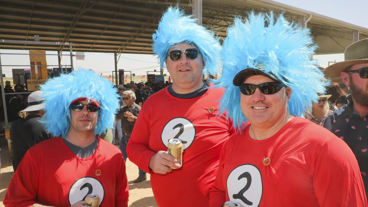 Nathan Chessman, Richard Czeglik and Tony Goldsmith from Adelaide got a new hair do especially for the races. Picture: Salty Dingo