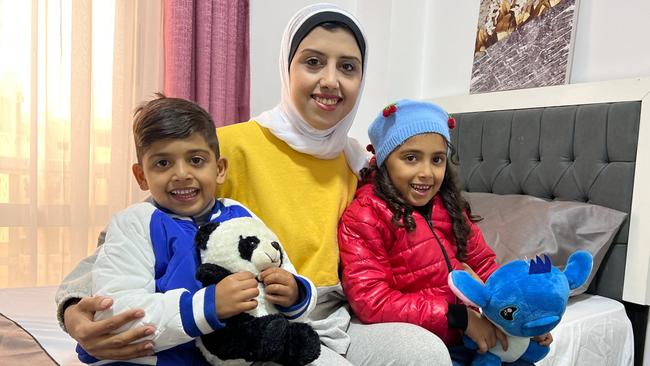 Amal Helles finally reached safety in Cairo with her children Wajj, four, and Maryam, six. Picture: Abdel Hakim Abu Dagen/The Times