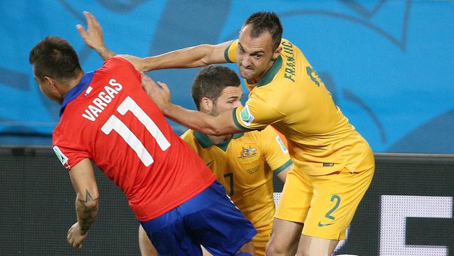 Ivan Franjic (R) battles with Chile’s Eduardo Vargas at the 2014 World Cup. Pic: George Salpigtidis