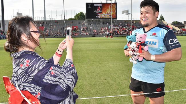 Takuma Asahara of the Sunwolves poses for a photo in a Waratahs jersey.