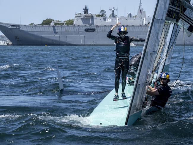 Taylor Canfield, driver of USA SailGP Team, stands on the hull after the USA SailGP Team F50 catamaran capsized. Picture: SailGP