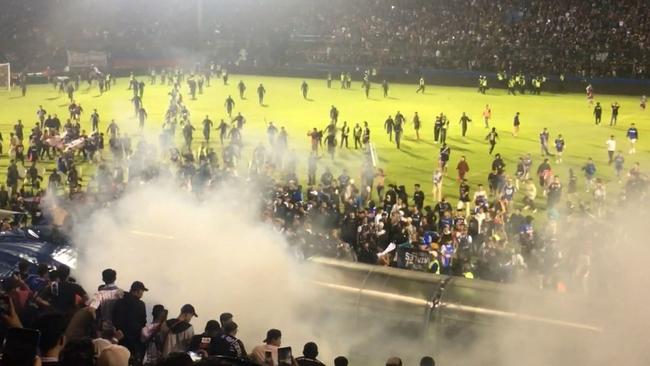 Indonesian police broke FIFA rules when they used tear gas quell fighting at a soccer game in East Java on Sunday.
