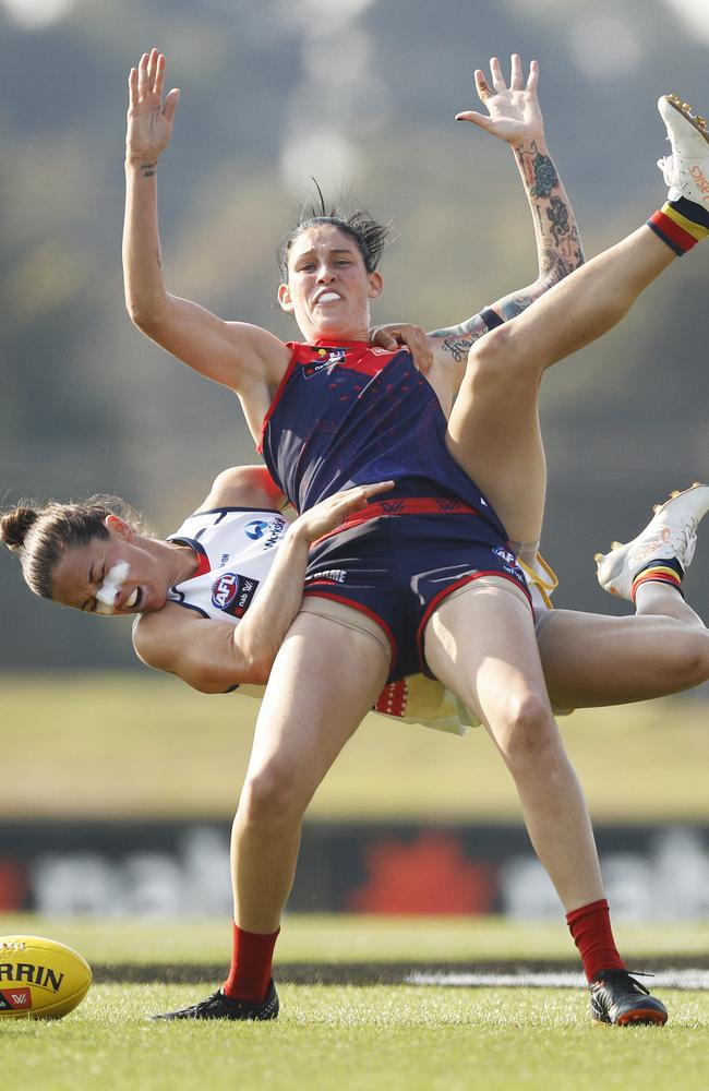 Angela Foley lays a spectacular tackle on Demon Tegan Cunningham.