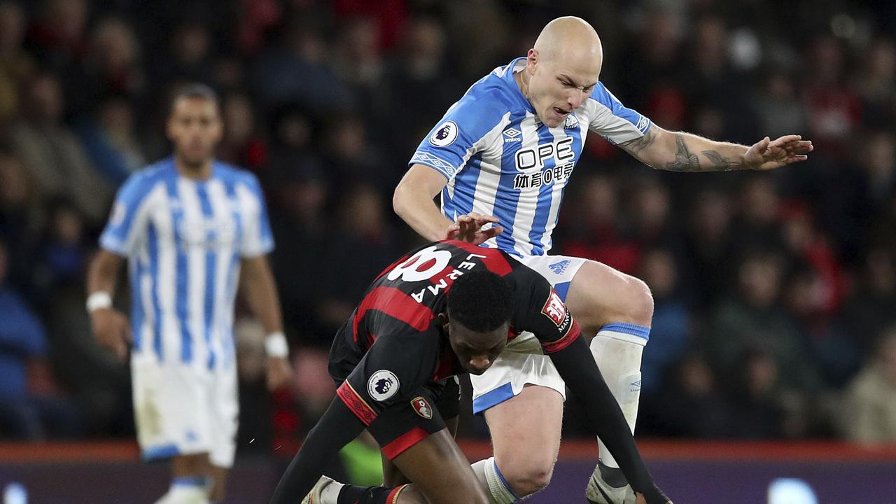 Bournemouth's Jefferson Lerma, left, and Huddersfield Town's Aaron Mooy. (Adam Davy/PA via AP)