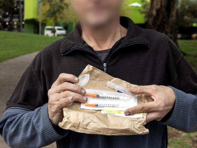 A heroin user with items supplied by the safe injecting room. Picture: David Geraghty