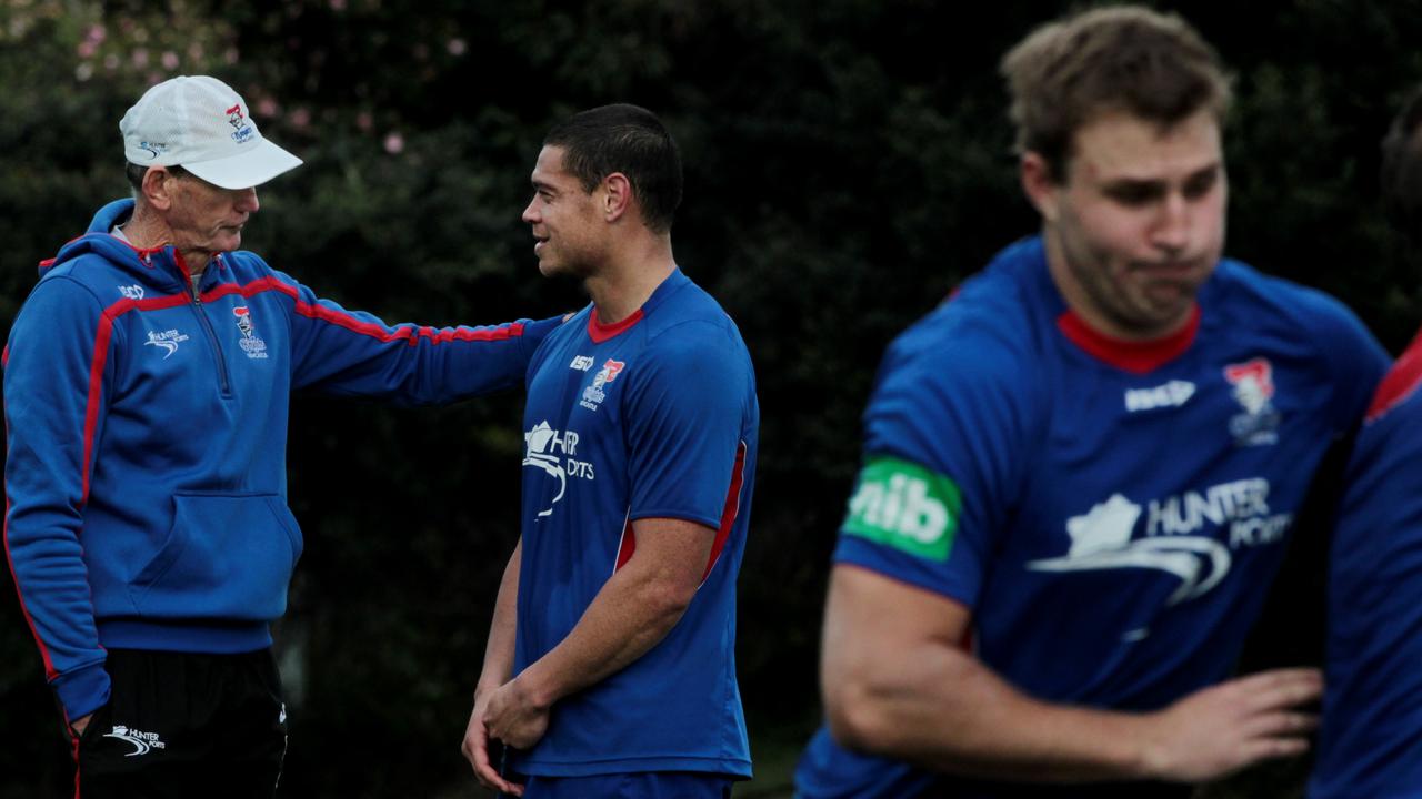 Tahu shares a moment with Knights coach Wayne Bennett.