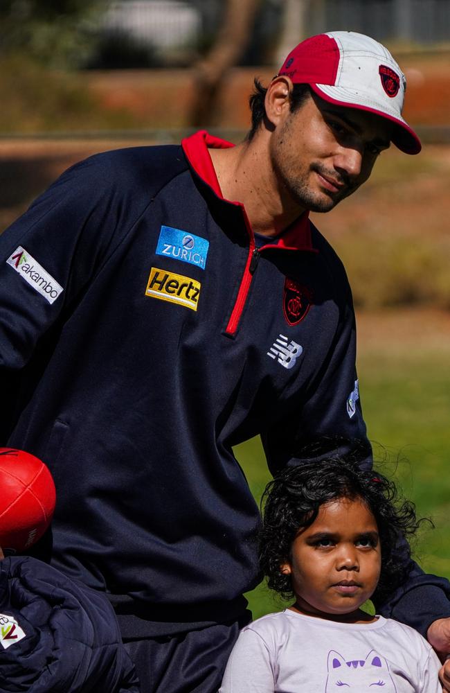 Melbourne Demons players Shane McAdam and Andy Moniz-Wakefield went to Santa Teresa ahead of the 2025 AFL game in Alice Springs. Picture: Melbourne Demons