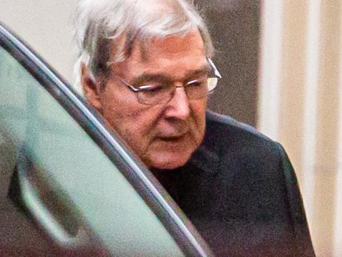 Australian Cardinal George Pell (L) is escorted into the Supreme Court of Victoria in Melbourne on June 6, 2019. - Pell asked appeals court judges to quash his landmark conviction for child sex abuse, branding the charges against him "bizarre" and "impossible". (Photo by ASANKA BRENDON RATNAYAKE / AFP)