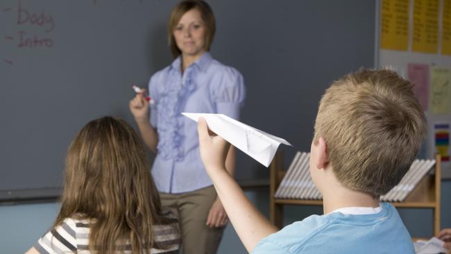 A mischievous student misbehaves in class.