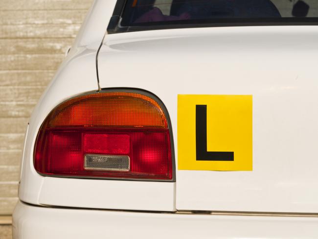 Image Of A Yellow L-Plate On White Car , Indicative Of A Learner Driver. Picture: iStock