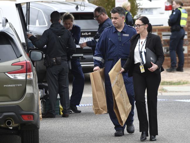 Detectives at the scene in December. Picture: Andrew Henshaw