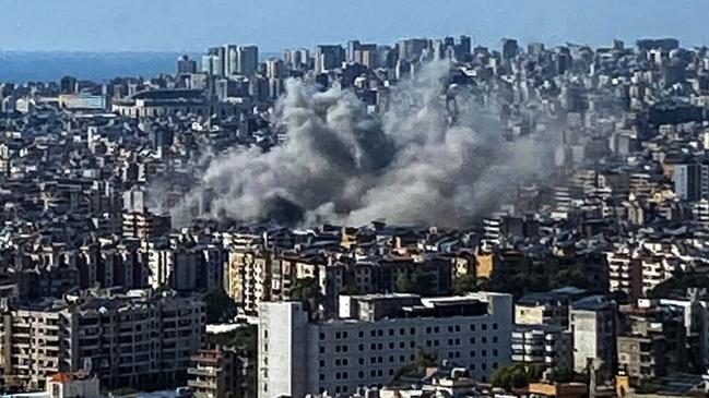 Thick smoke rises above the southern suburbs of Beirut after an Israel strike on September 20, 2024. (Photo by AFP)