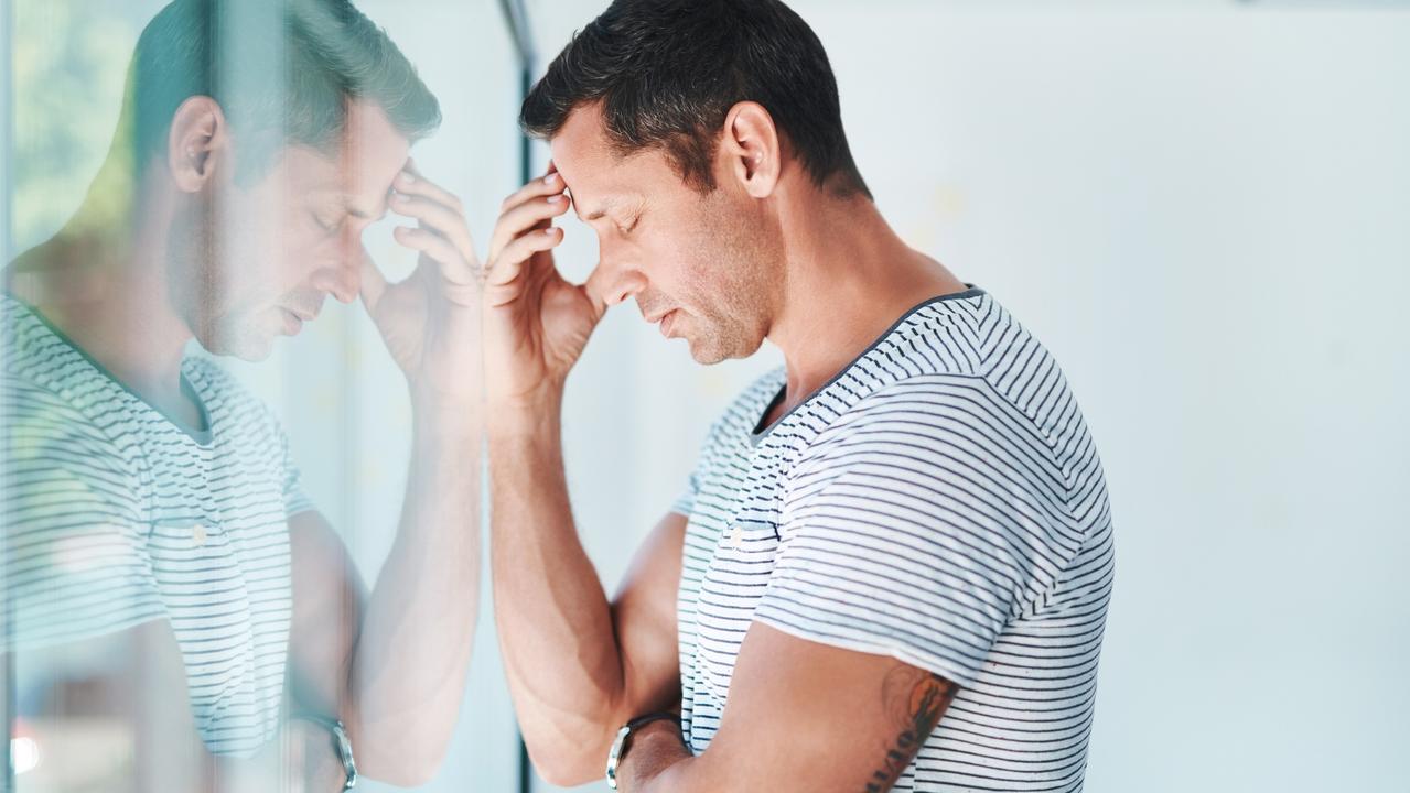 Shot of a mature businessman looking stressed out in an office