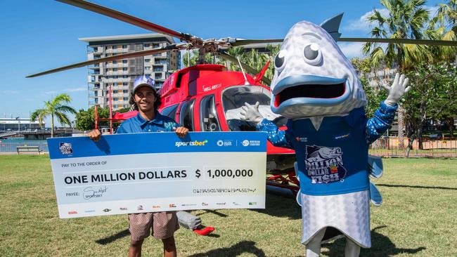 Keegan Payne with his cheque for a million dollars. Picture: Pema Tamang Pakhrin