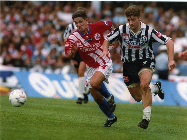 Melbourne Knights midfielder Mark Silic (Left) chases Damian Mori (Right) in the 1994 grand final at Olympic Park. Mori scored the winning goal for Adelaide City.