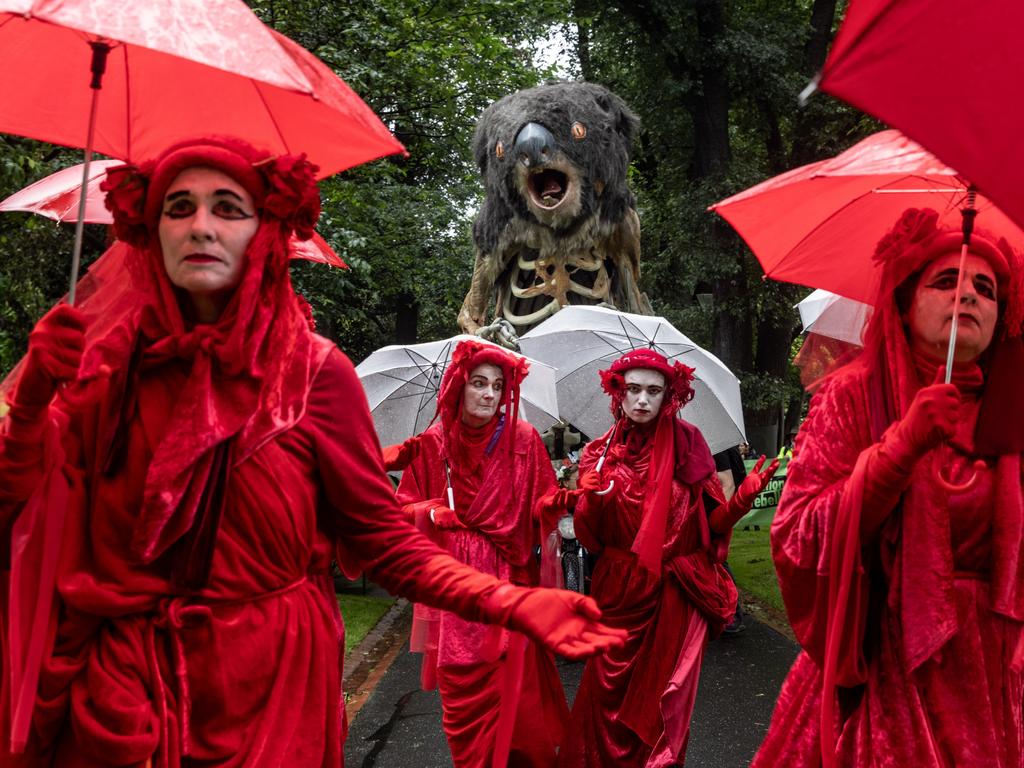 MELBOURNE, AUSTRALIA - DECEMBER 09: Environmental activists march through Treasury Garden on December 09, 2023 in Melbourne, Australia. The eastern seaboard of Australia is facing a severe heatwave, with temperatures predicted to exceed 40 degrees celsius in many places. The hot weather could be a trigger for devastating bushfires. Climate change continues to be a contentious political topic in the country, which is one of the world's largest exporters of coal. (Photo by Diego Fedele/Getty Images)