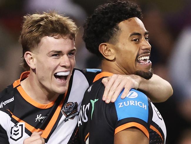 SYDNEY, AUSTRALIA - JUNE 23: Jahream Bula of the Tigers celebrates with team mates after scoring a try during the round 16 NRL match between Wests Tigers and Canberra Raiders at Campbelltown Stadium, on June 23, 2024, in Sydney, Australia. (Photo by Matt King/Getty Images)