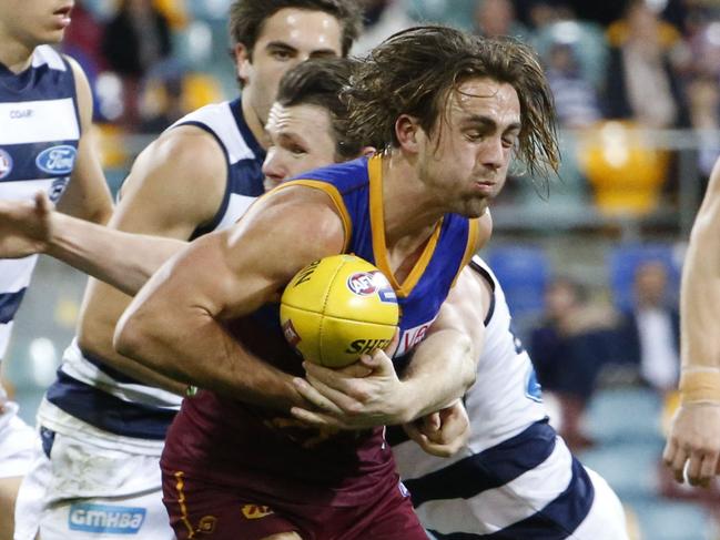 Rohan Bewick of the Lions with the  ball during the Round 16 AFL match between the Brisbane Lions and the Geelong Cats at the Gabba in Brisbane, Saturday, July 8, 2017. (AAP Image/Glenn Hunt) NO ARCHIVING, EDITORIAL USE ONLY