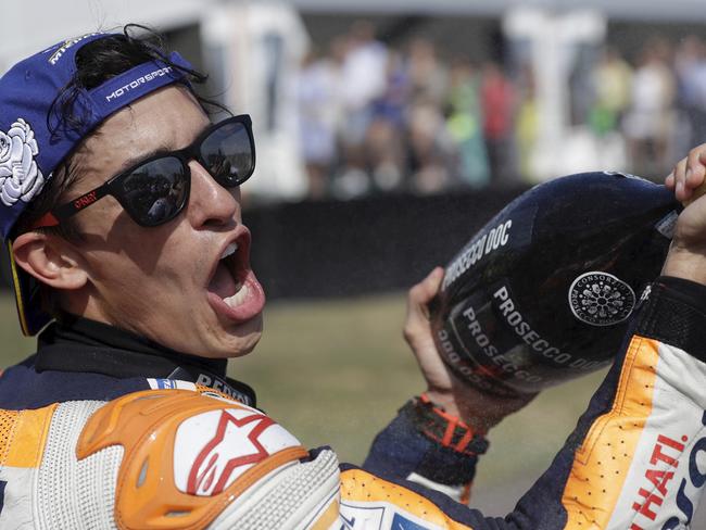 Spain's rider Marc Marquez of the Repsol Honda Team sprays champagne to celebrate his victory in the MotoGP race at the Czech Republic motorcycle Grand Prix at the Automotodrom Brno, in Brno, Czech Republic, Sunday, Aug. 4, 2019. (AP Photo/Petr David Josek)