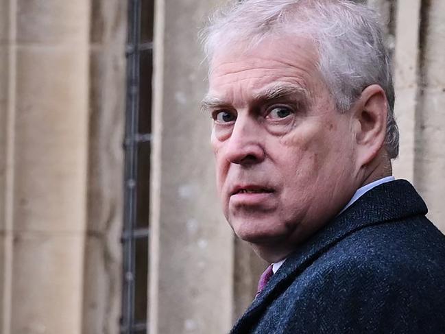 Britain's Prince Andrew, Duke of York reacts as he arrives for the Royal Family's traditional Christmas Day service at St Mary Magdalene Church in Sandringham, Norfolk, eastern England, on December 25, 2022. (Photo by Daniel LEAL / AFP)