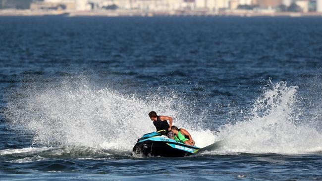 Jetski riders on Botany Bay at Ramsgate Beach. Picture: Jonathan Ng