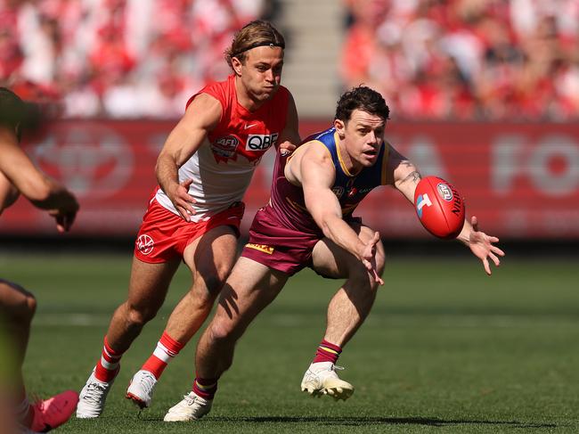 MELBOURNE, AUSTRALIA - SEPTEMBER 28: Lachie Neale of the Lions chases the ball during the AFL Grand Final match between Sydney Swans and Brisbane Lions at Melbourne Cricket Ground, on September 28, 2024, in Melbourne, Australia. (Photo by Robert Cianflone/AFL Photos via Getty Images)