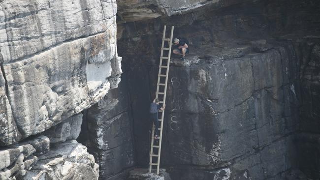 A ladder has been placed there to help people climb to narrow ledges. Photo: Tim Pascoe