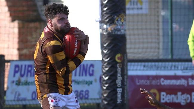 Woodend-Hesket coach Josh Pound takes mark. Picture: Hamish Blair