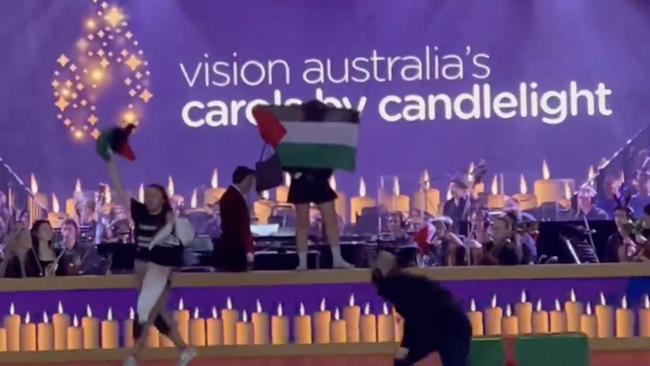 Christmas Eve 2023 Carols by Candlelight at the Sidney Myer Music Bowl in Melbourne has been interrupted by pro-Palestine protesters storming the stage.