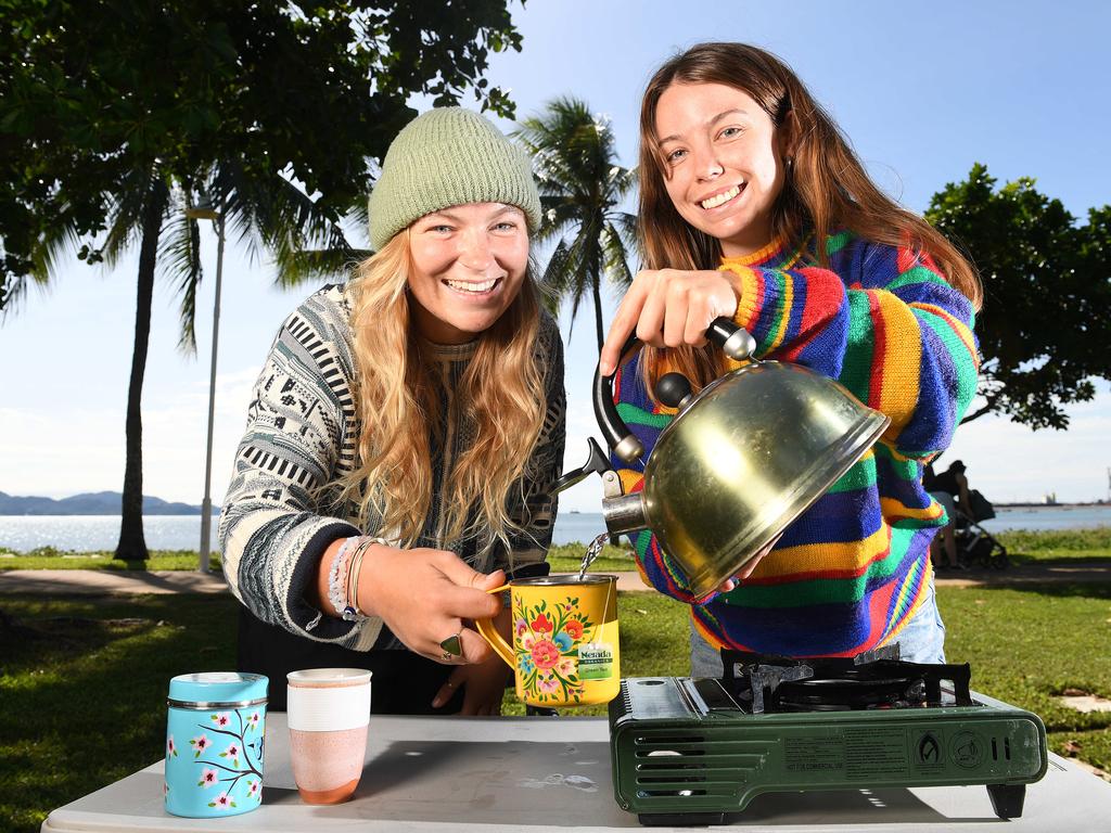 Alicia McGrade and Sarah Durrant, from Perth, warm up with a cuppa on the Strand. Picture: Shae Beplate.