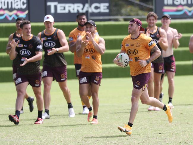 Broncos players cheer Darius Boyd to the try line. Picture: Annette Dew