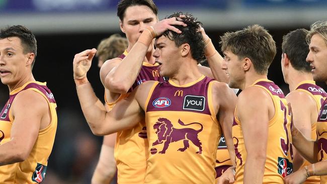 GOLD COAST, AUSTRALIA - JULY 27: Cam Rayner of the Lions celebrates kicking a goal during the round 20 AFL match between Gold Coast Suns and Brisbane Lions at People First Stadium, on July 27, 2024, in Gold Coast, Australia. (Photo by Matt Roberts/AFL Photos/via Getty Images)