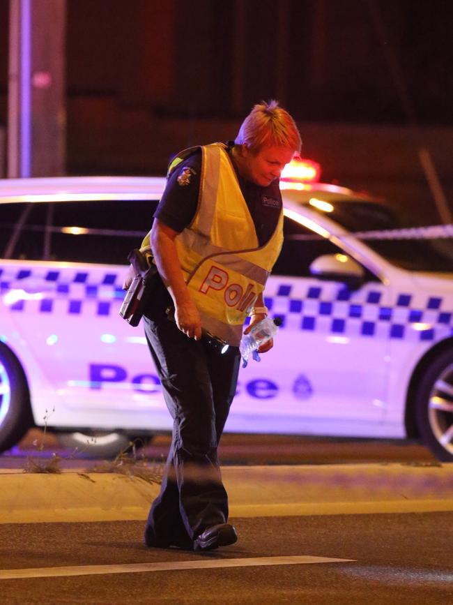 Police comb the scene for clues. Picture: Wayne Taylor