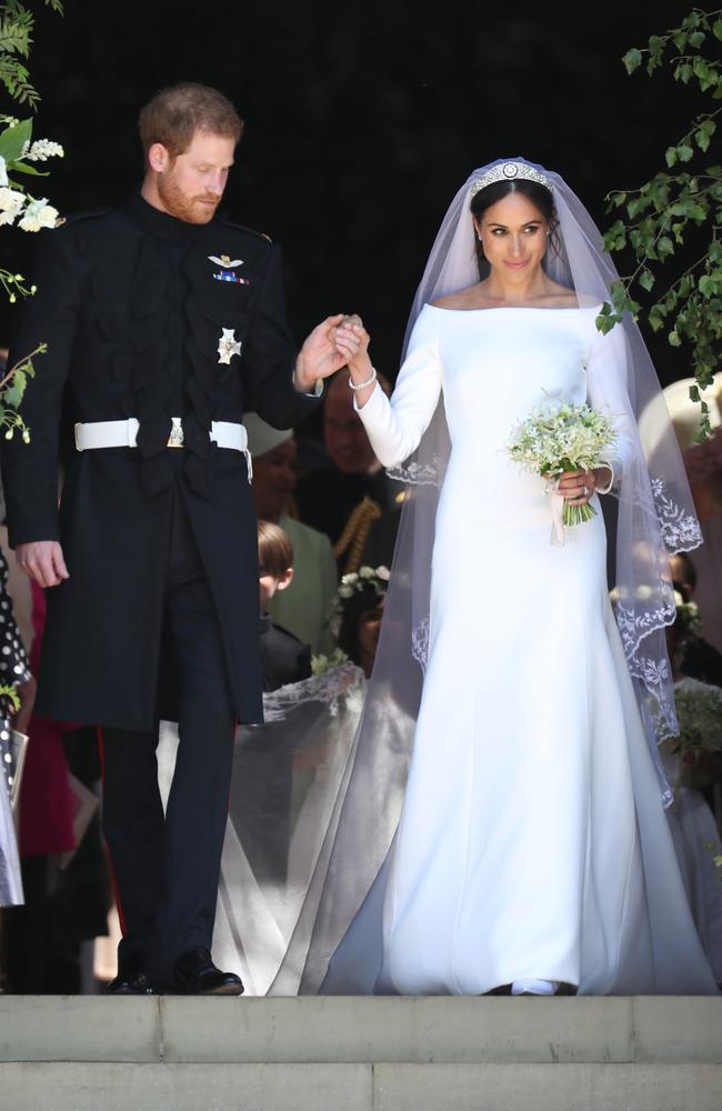 Britain's Prince Harry, Duke of Sussex and his wife Meghan, Duchess of Sussex leave from the West Door of St George's Chapel, Windsor Castle, in Windsor, on May 19, 2018 after their wedding ceremony. Picture: AFP PHOTO/ Jane Barlow