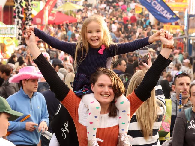 Louise Spathonis with Lacey, 5 in the crowd at EKKA, Bowen Hills. Picture: Liam Kidston