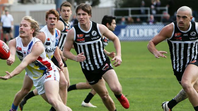 Will Sam Powell-Pepper, right, in action against Central District in the SANFL on Sunday, force his way back into the AFL team? Picture: AAP/Emma Brasier